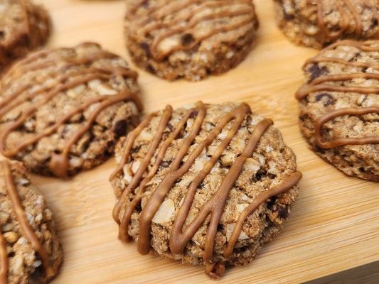 Gluten free hazelnut mocha oat scone with espresso drizzle on wooden cutting board